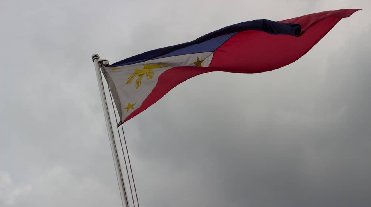 Philippine flag on a cloudy sky